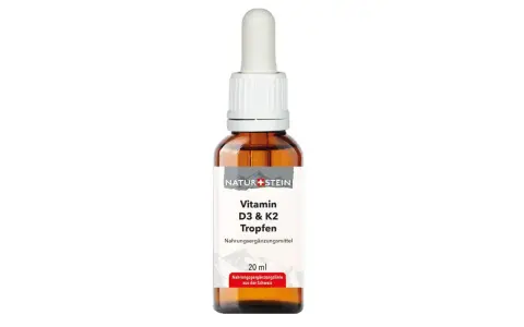 Braune Glasflasche mit Pipette, gefüllt mit Vitamin D3 & K2 Tropfen.