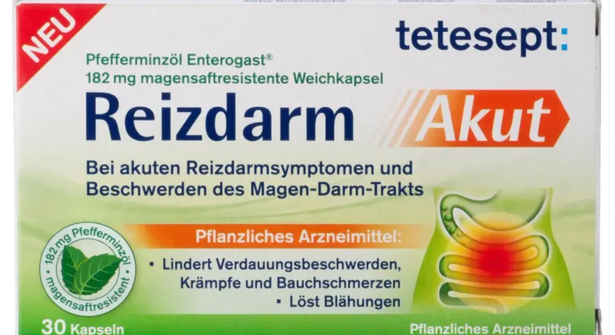 Verpackung von Reizdarm Akut mit Pfefferminzöl, magensaftresistenten Kapseln und Abbildung des Verdauungstrakts.